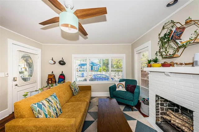 a living room with furniture and a fireplace