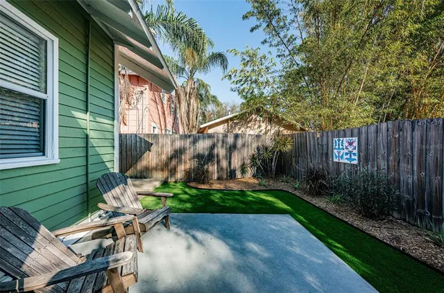 a backyard of a house with lots of green space