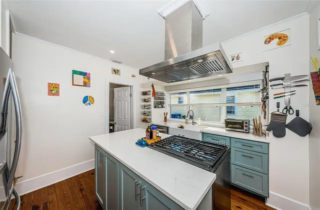 a kitchen with a stove and a refrigerator
