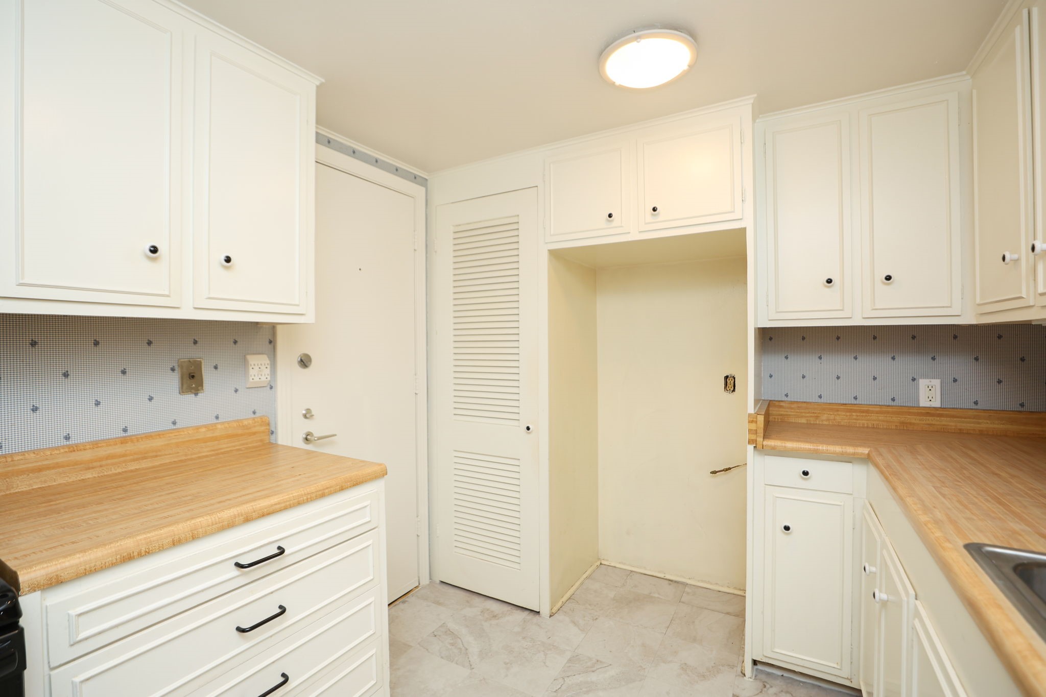 666 South Ripple Creek Drive, Unit 666 Houston, TX 77057 - Photo 14 of 49 a view of cabinets a sink and dishwasher in a kitchen