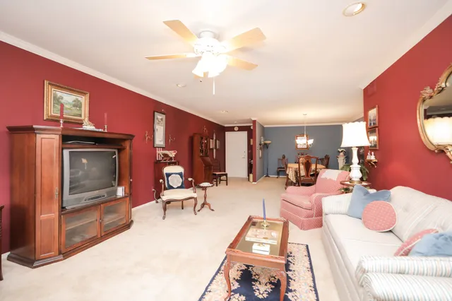a bedroom with bed and a chandelier