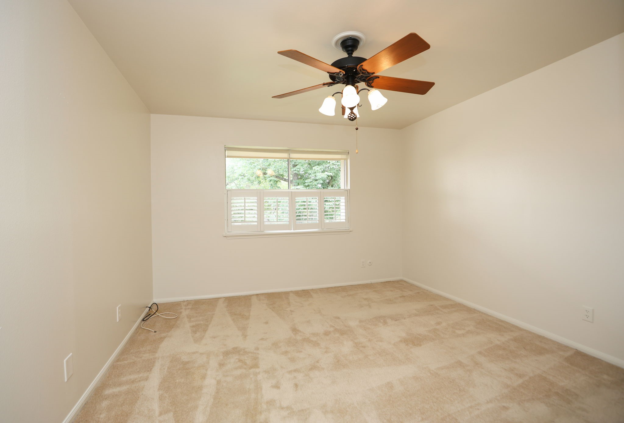 666 South Ripple Creek Drive, Unit 666 Houston, TX 77057 - Photo 18 of 49 an empty room with windows and fan