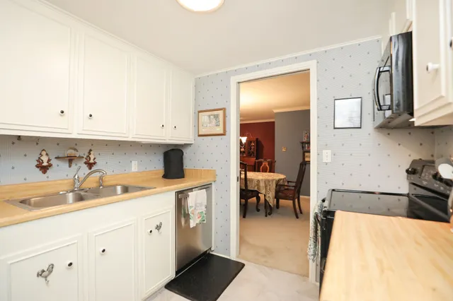 a view of a backyard with sitting area