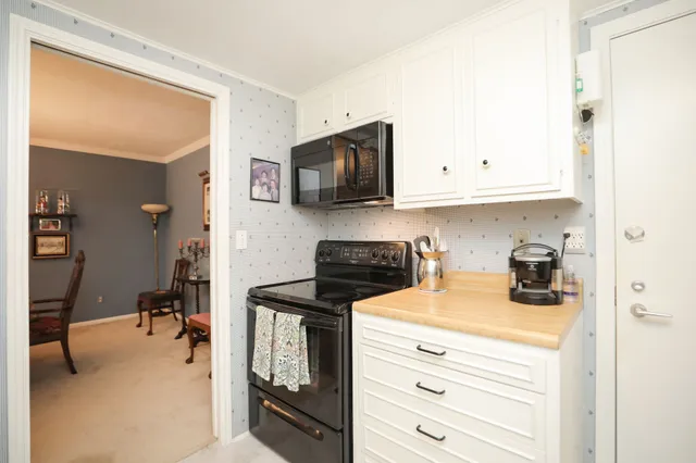 a view of a house with backyard porch and sitting area