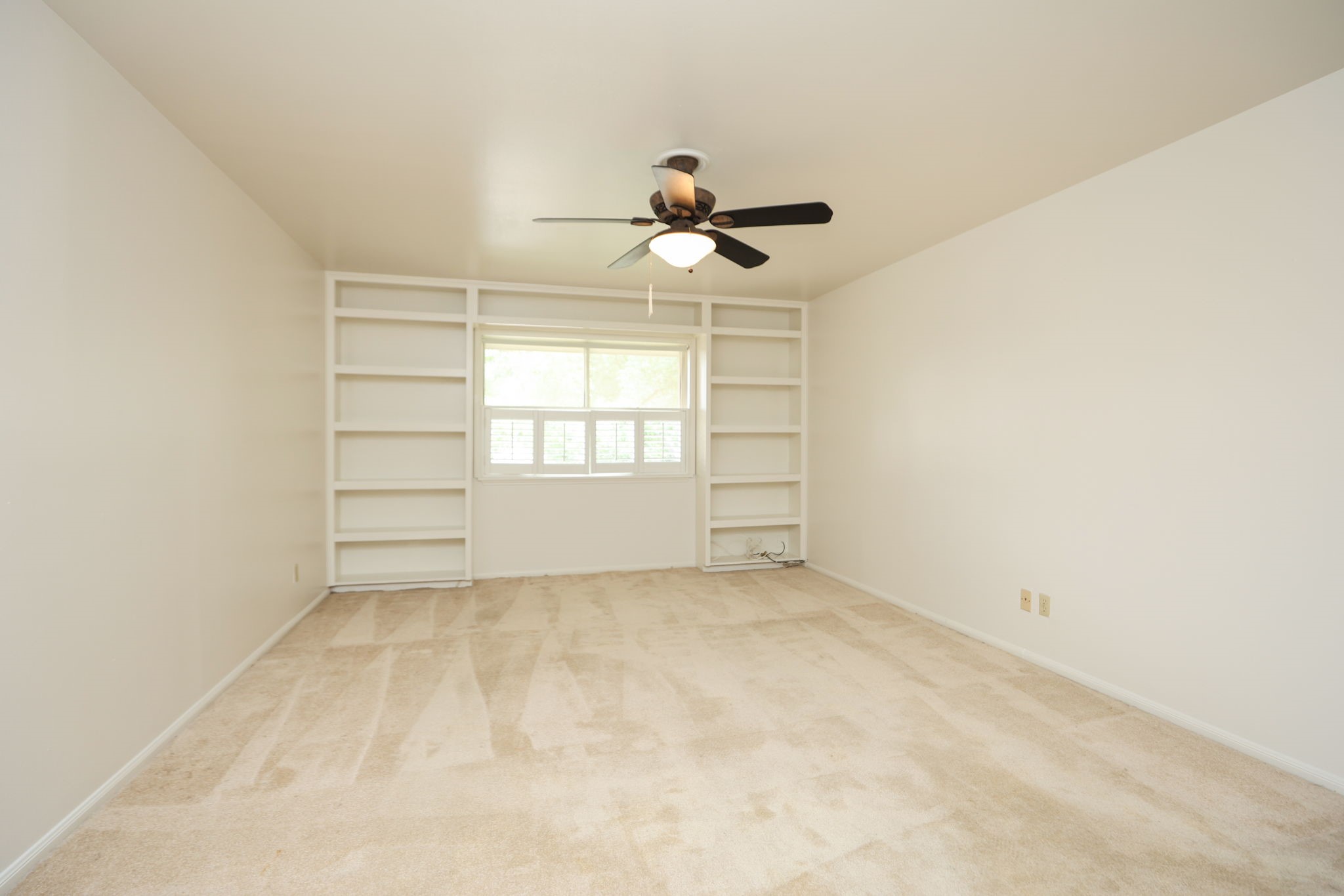 666 South Ripple Creek Drive, Unit 666 Houston, TX 77057 - Photo 23 of 49 an empty room with windows and ceiling fan