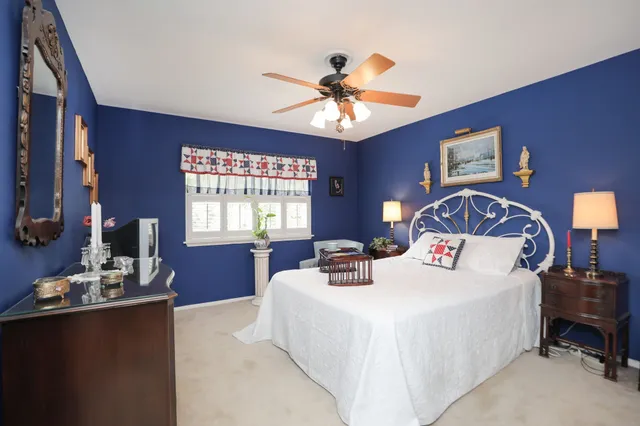 an aerial view of a house with garden space and street view