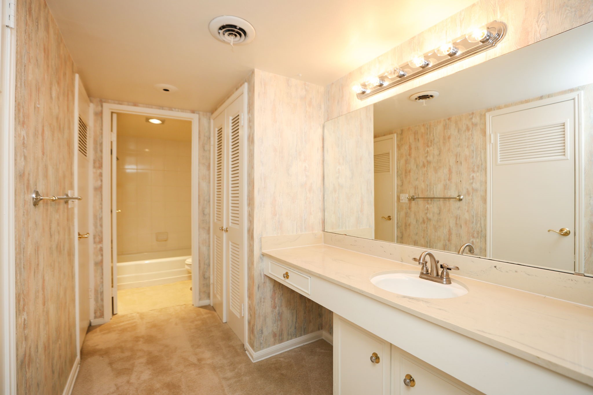 666 South Ripple Creek Drive, Unit 666 Houston, TX 77057 - Photo 25 of 49 a bathroom with a sink and a mirror