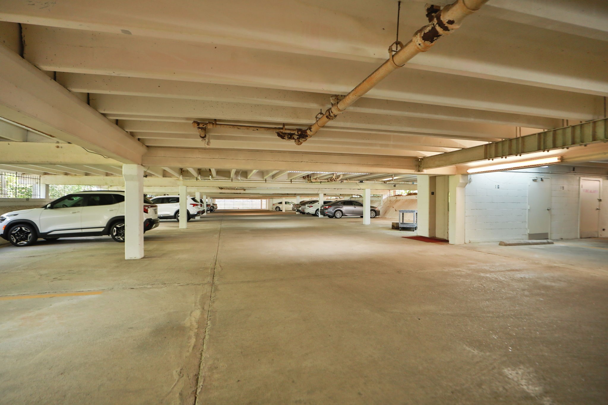 666 South Ripple Creek Drive, Unit 666 Houston, TX 77057 - Photo 37 of 49 a view of parking garage with cars