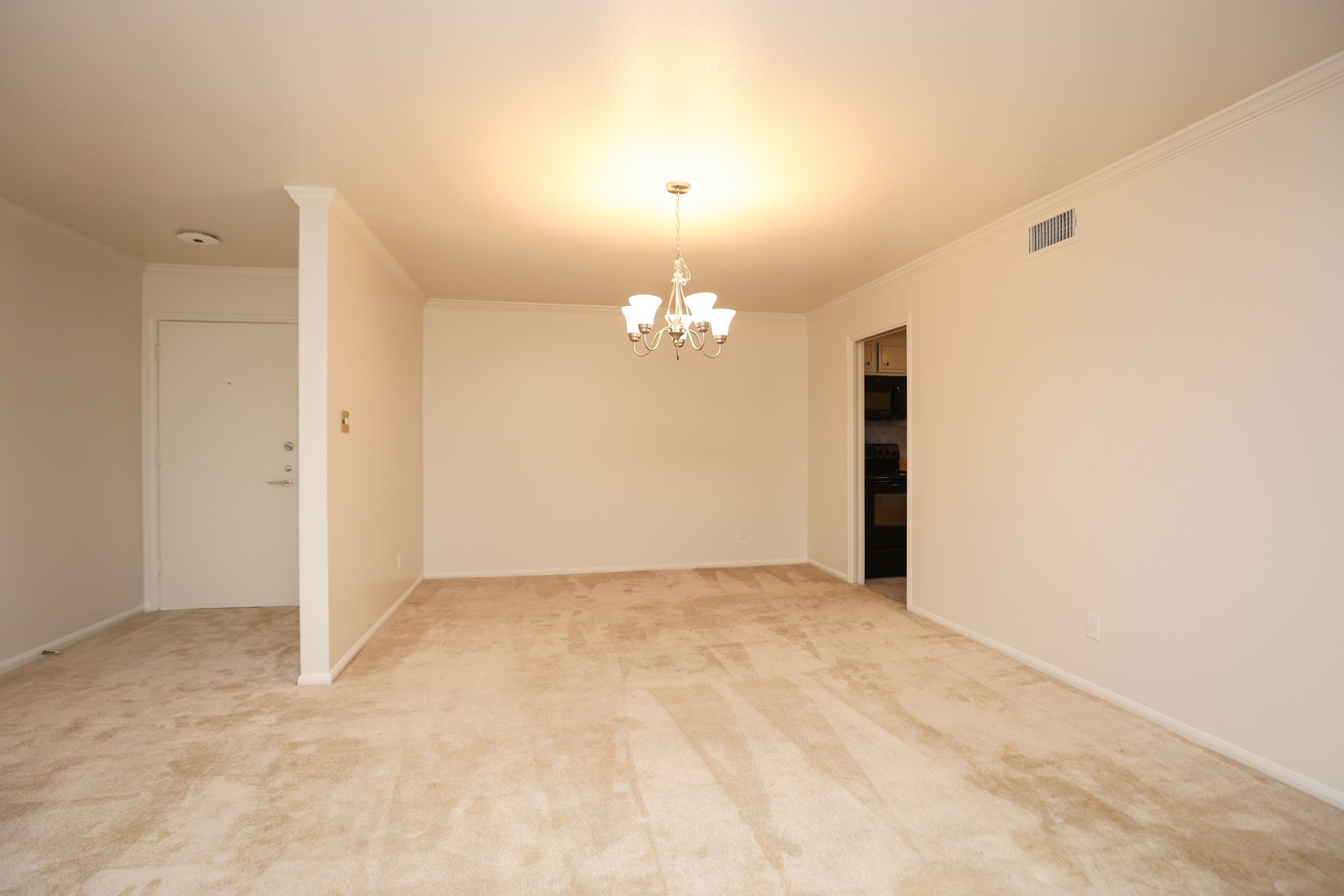 666 South Ripple Creek Drive, Unit 666 Houston, TX 77057 - Photo 4 of 49 a view of an empty room with chandelier and a window