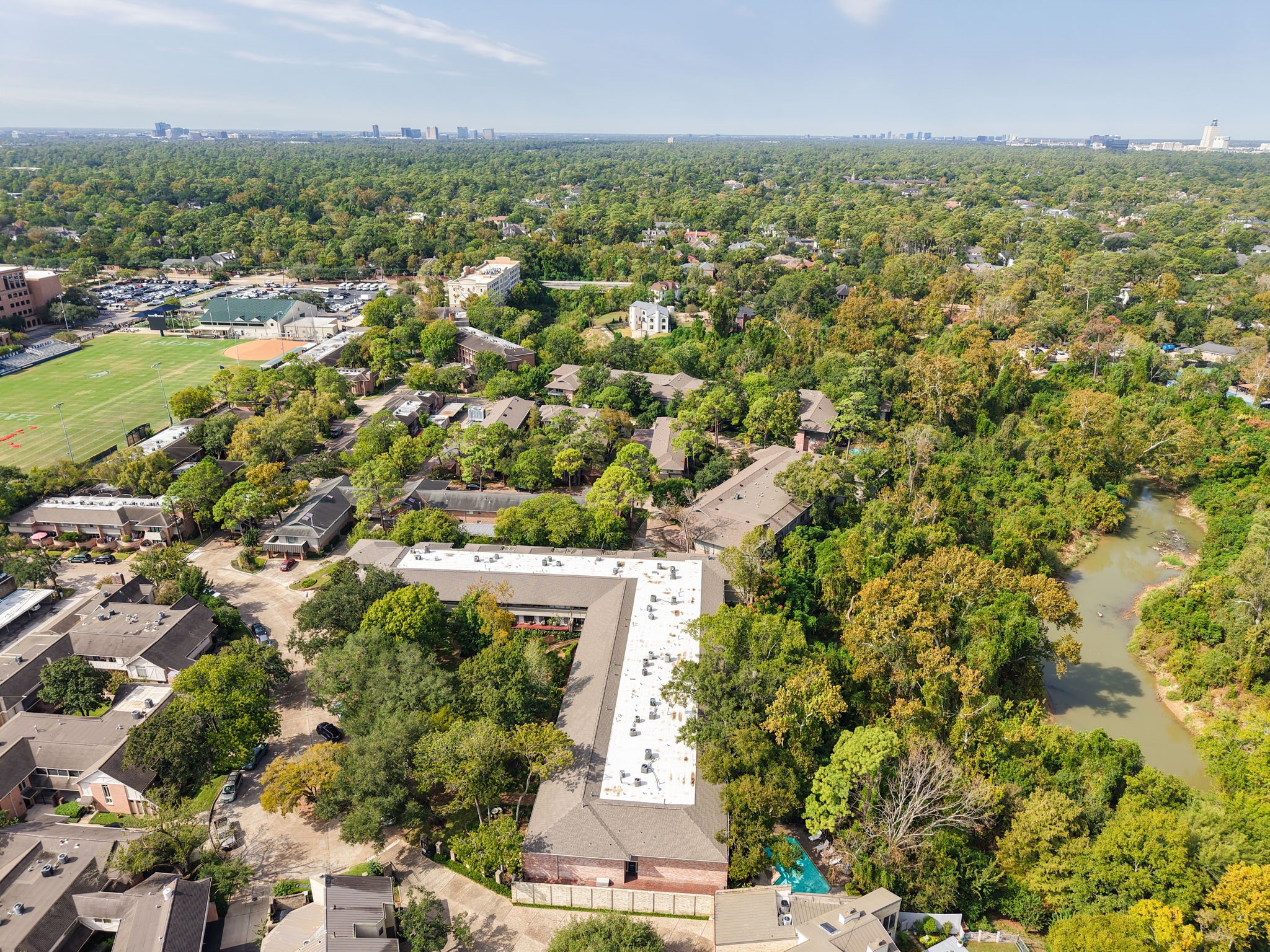 666 South Ripple Creek Drive, Unit 666 Houston, TX 77057 - Photo 47 of 49 an aerial view of residential houses with outdoor space and trees