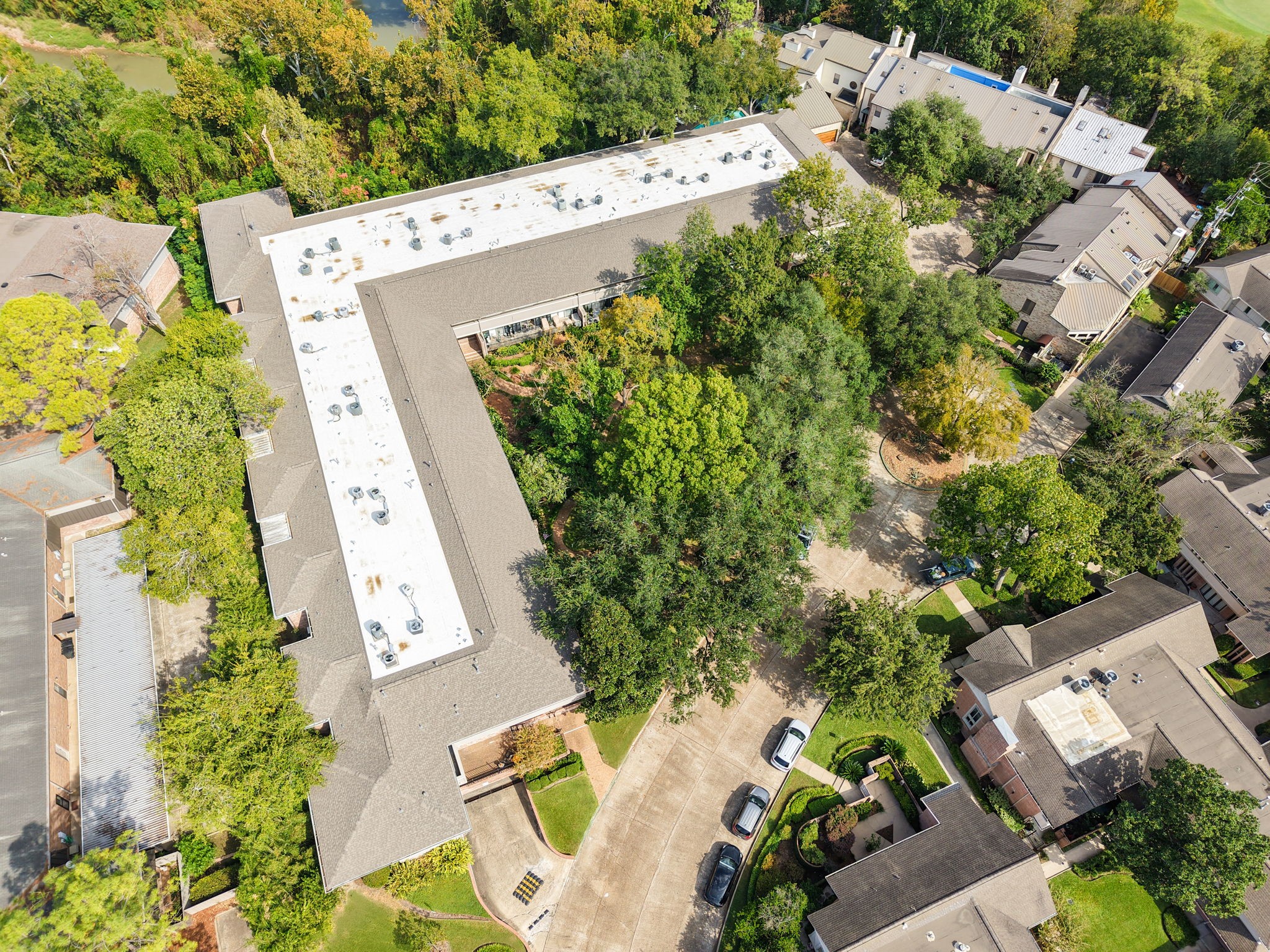 666 South Ripple Creek Drive, Unit 666 Houston, TX 77057 - Photo 49 of 49 an aerial view of a house with a yard and garden in front of it
