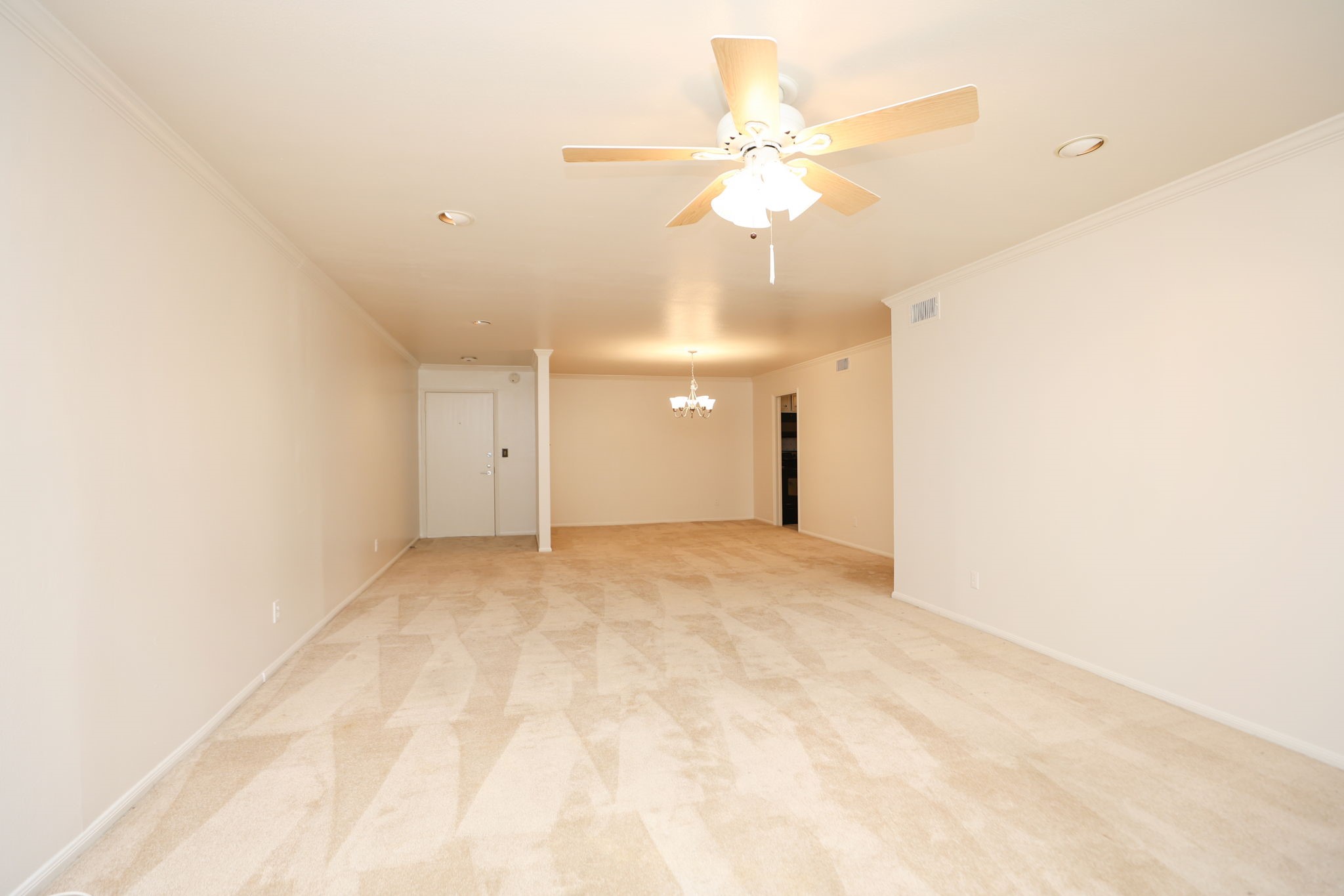 666 South Ripple Creek Drive, Unit 666 Houston, TX 77057 - Photo 6 of 49 an empty room with a chandelier fan and closet