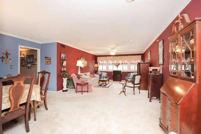 a kitchen with granite countertop a refrigerator stove and sink