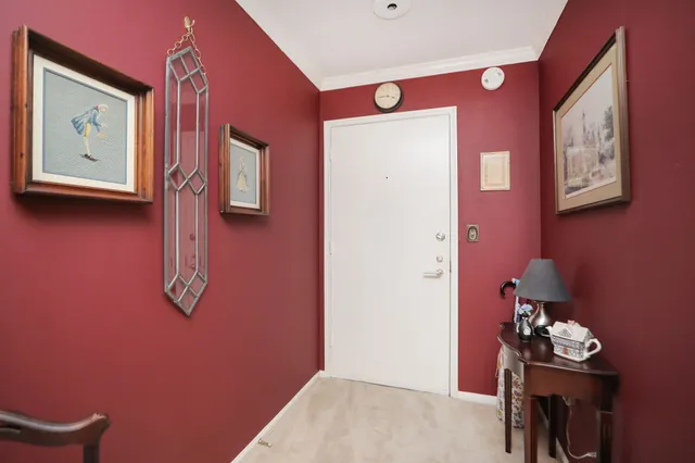 a kitchen with stainless steel appliances granite countertop a refrigerator and white cabinets