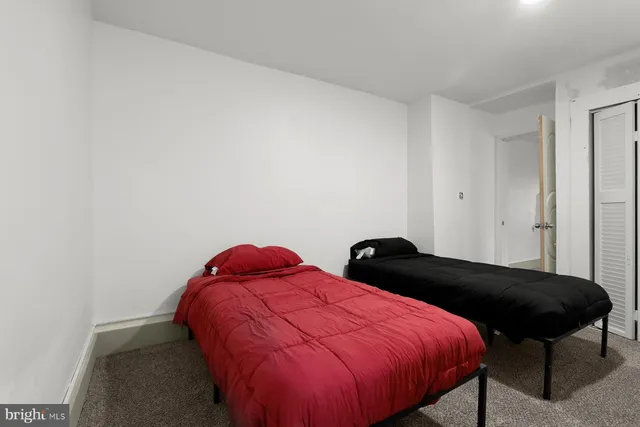 a bedroom with a bed and a closet