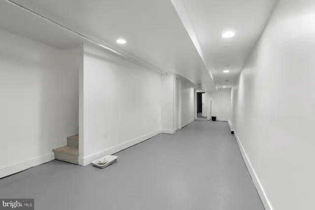 an empty room with a bathroom