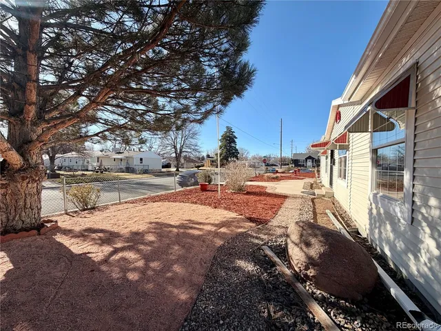 a view of a yard next to a lake view