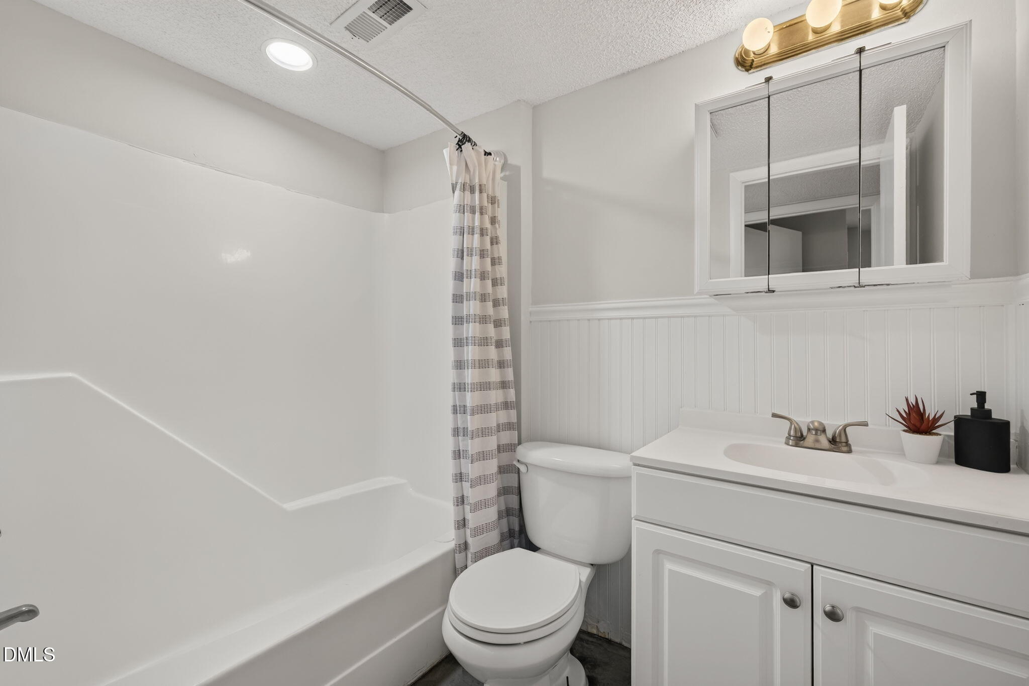 546 Pine Ridge Place Raleigh, NC 27609 - Photo 14 of 21 a bathroom with a sink a toilet and shower