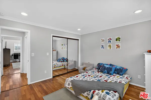 a bedroom with a bed and a view of bedroom