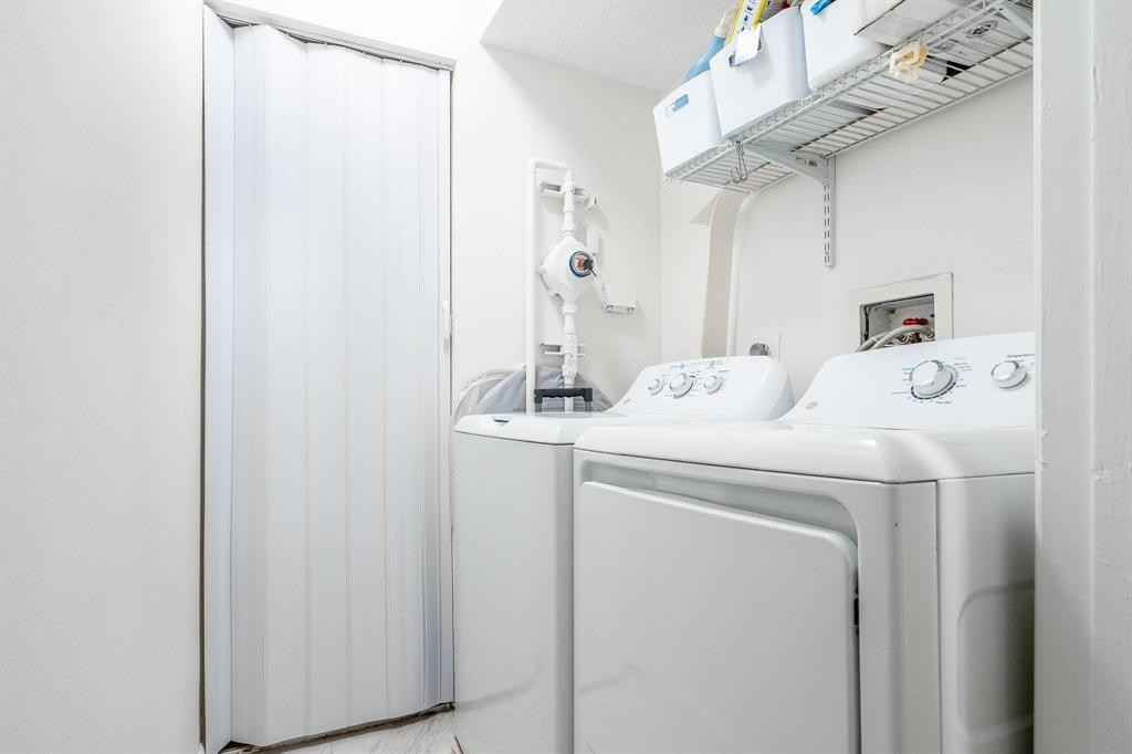 8851 Wiles Road, Unit 305 Coral Springs, FL 33067 - Photo 12 of 17 a utility room with dryer and washer