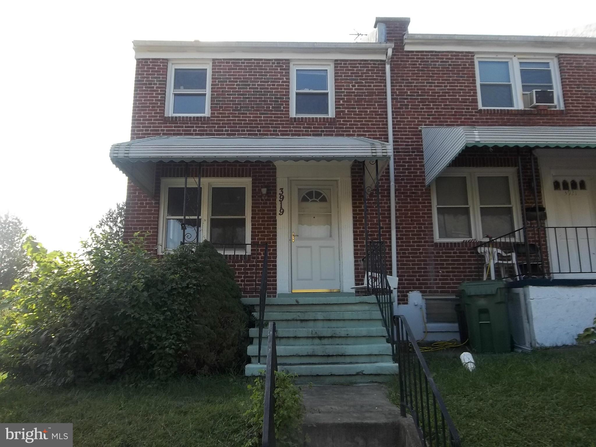 3919 Colchester Road Baltimore, MD 21229 - Photo 1 of 13 a front view of a house with a garden