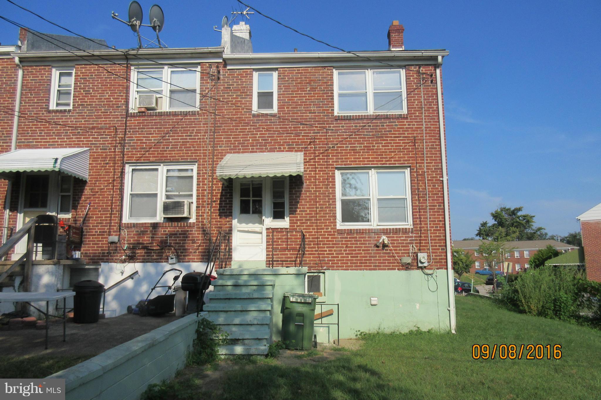 3919 Colchester Road Baltimore, MD 21229 - Photo 2 of 13 a front view of a house with garden