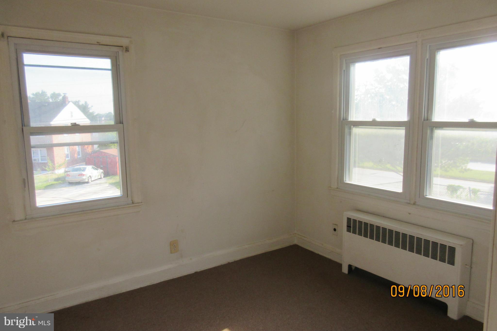 3919 Colchester Road Baltimore, MD 21229 - Photo 11 of 13 a view of an empty room and window