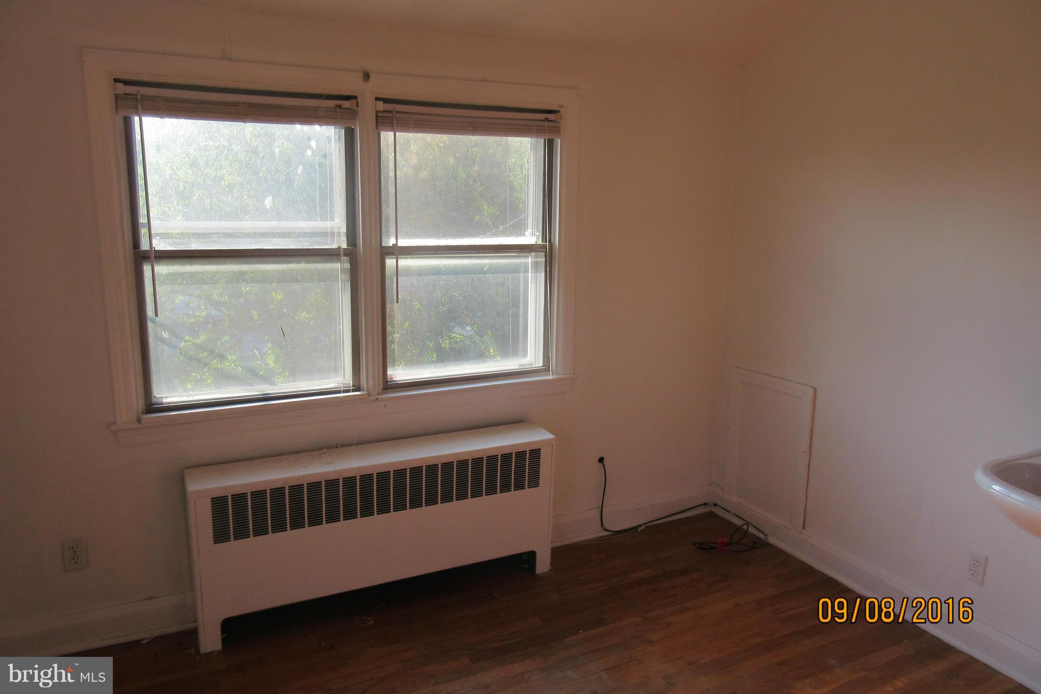 3919 Colchester Road Baltimore, MD 21229 - Photo 12 of 13 a view of wooden floor and windows in a room