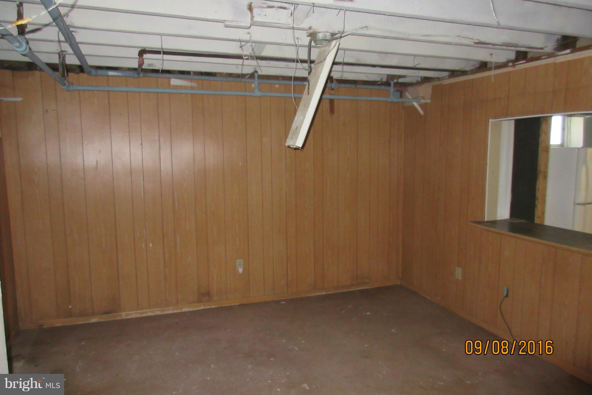 3919 Colchester Road Baltimore, MD 21229 - Photo 5 of 13 a view of a room with wooden walls