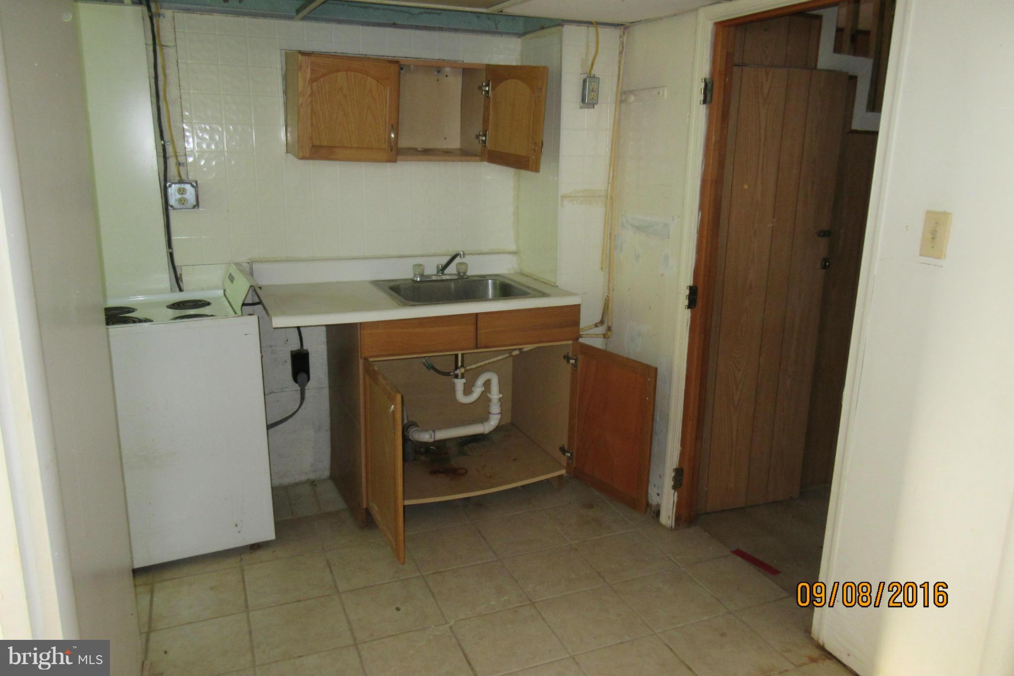 3919 Colchester Road Baltimore, MD 21229 - Photo 6 of 13 a utility room with a sink