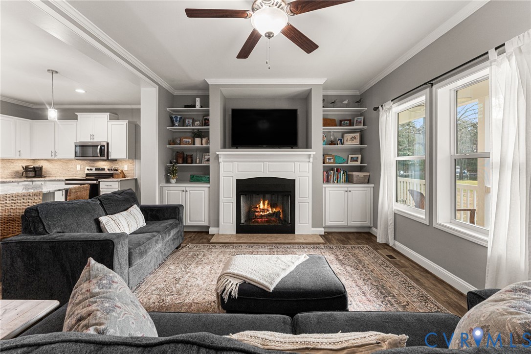 613 Doctors Point Road Lottsburg, VA 22511 - Photo 19 of 50 a living room with furniture and a fireplace