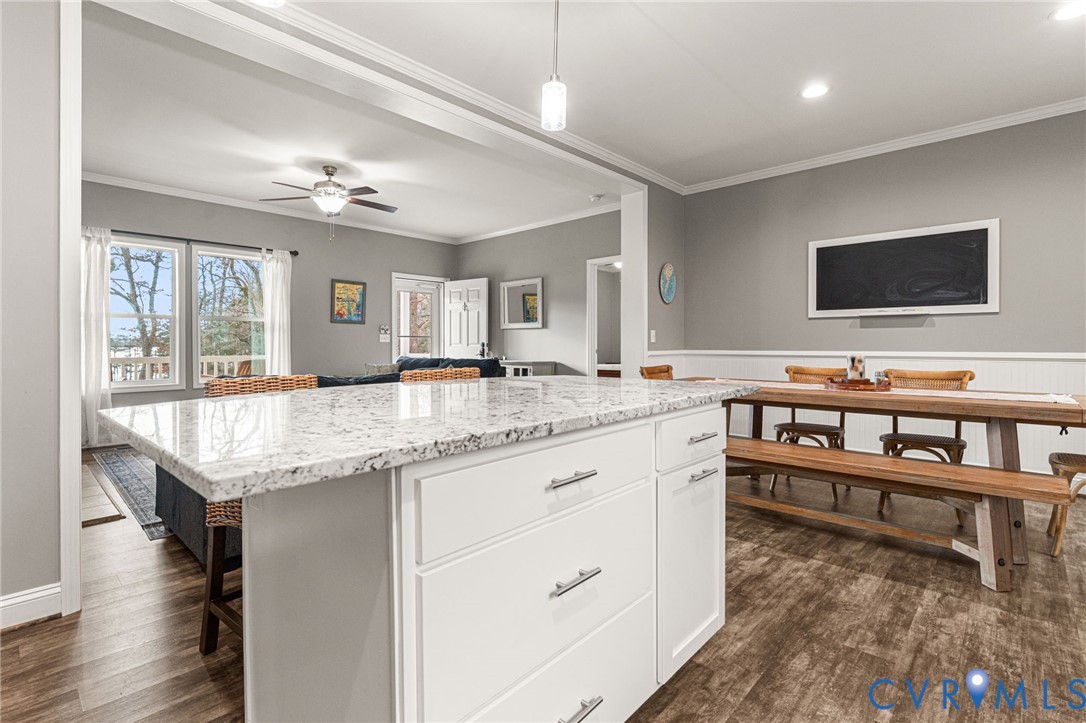 613 Doctors Point Road Lottsburg, VA 22511 - Photo 28 of 50 a living room with granite countertop furniture and a flat screen tv