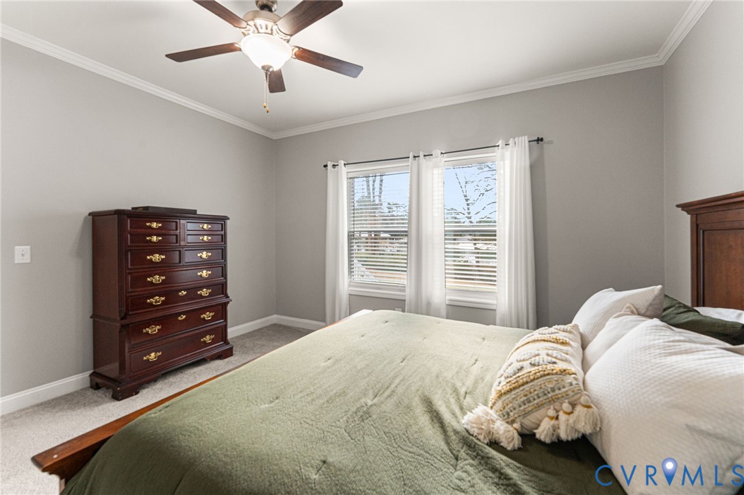 613 Doctors Point Road Lottsburg, VA 22511 - Photo 29 of 50 a bedroom with a bed and a dresser