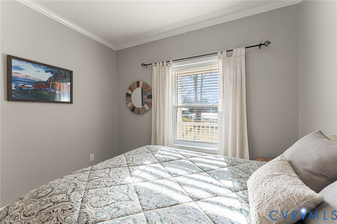 613 Doctors Point Road Lottsburg, VA 22511 - Photo 37 of 50 a bedroom with a bed and a window