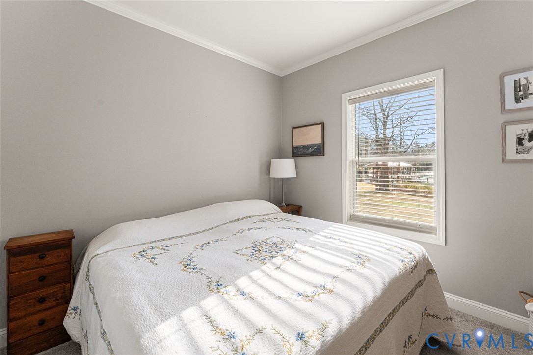 613 Doctors Point Road Lottsburg, VA 22511 - Photo 38 of 50 a bedroom with a bed and a window