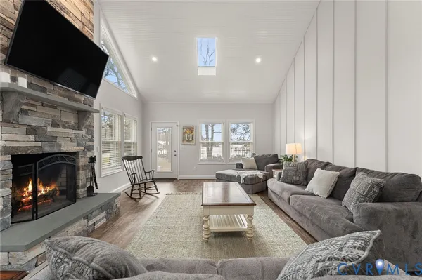 a living room with furniture and a fireplace