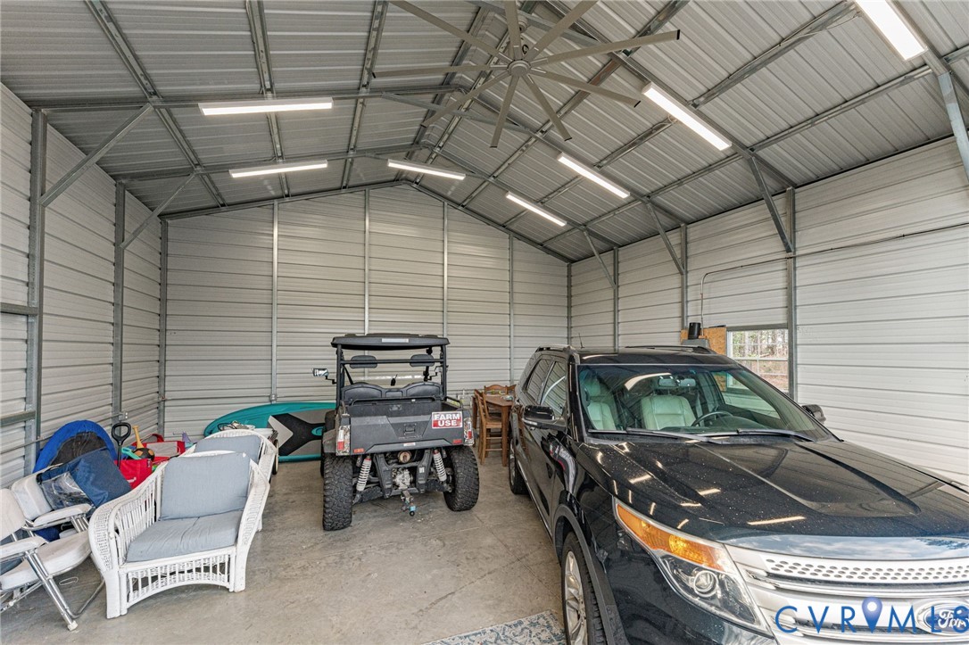 613 Doctors Point Road Lottsburg, VA 22511 - Photo 42 of 50 a backyard of a house with outdoor seating