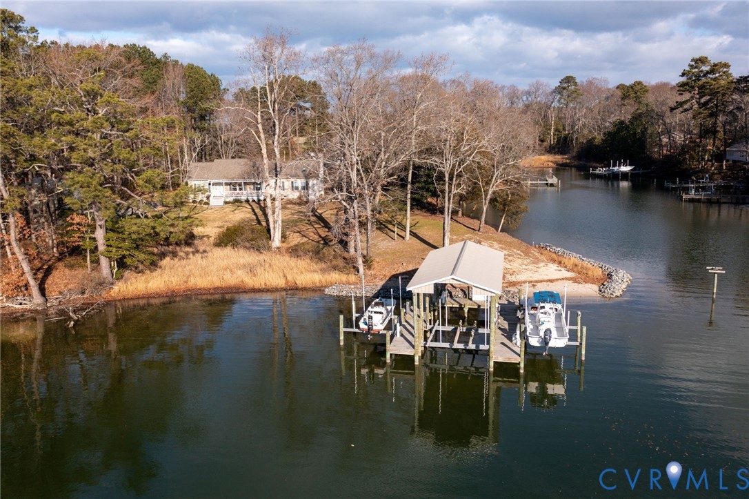 613 Doctors Point Road Lottsburg, VA 22511 - Photo 46 of 50 a view of a lake with a mountain view