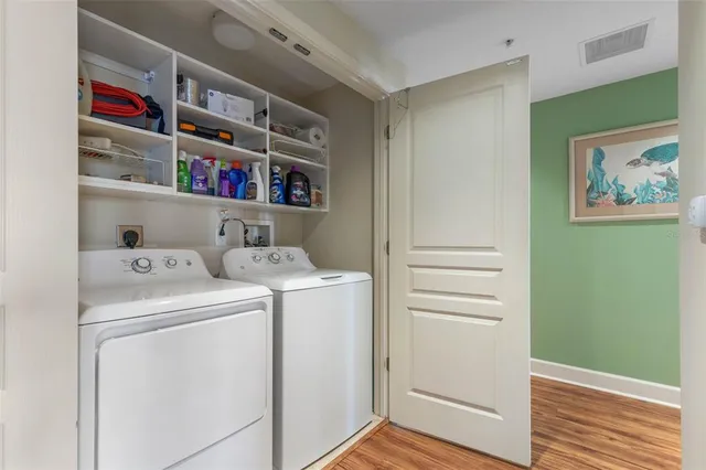 a view of living room filled with furniture and a chandelier