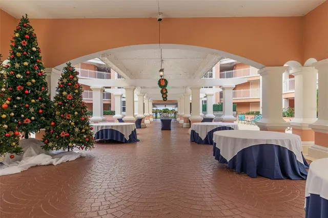 a living room with lots of furniture and a large window