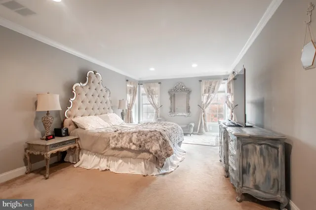 a bed room with a bed and a chair