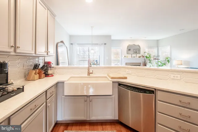 a kitchen with a sink cabinets and window