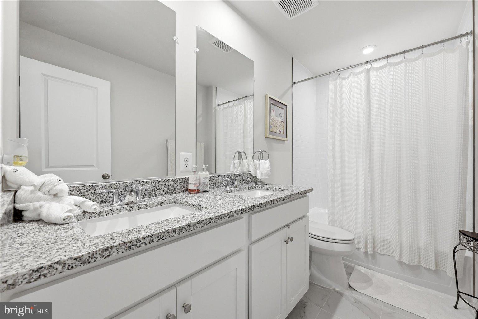 359 National Street Ranson, WV 25438 - Photo 39 of 58 a bathroom with a granite countertop sink and a mirror