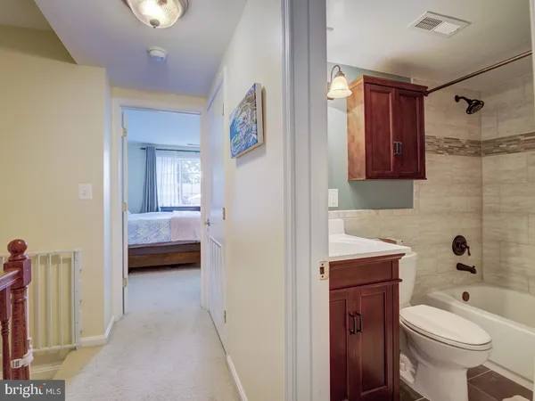 a bathroom with a toilet sink and shower