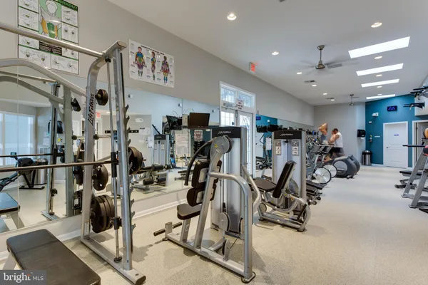a living room with furniture pool table and sofas