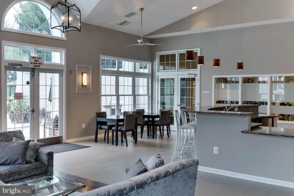 a large kitchen with a table and chairs