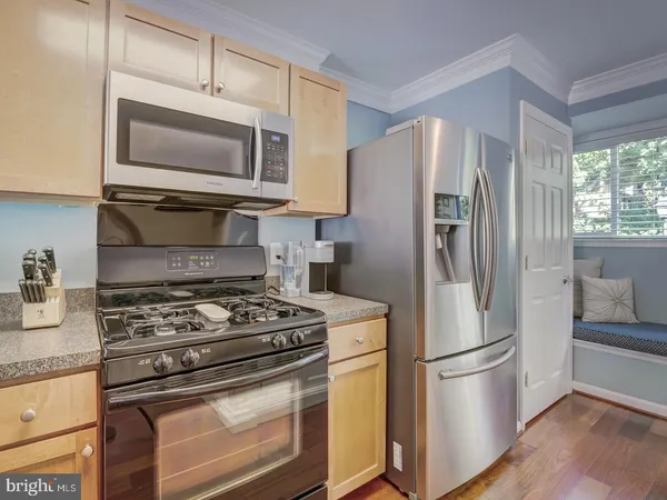 a kitchen with a stove microwave and refrigerator