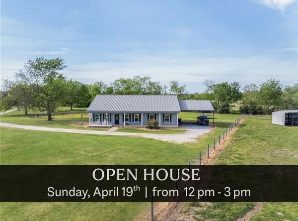 a view of a big house with a big yard