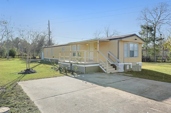 a house view with a backyard space