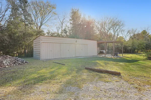 a view of a backyard with large trees